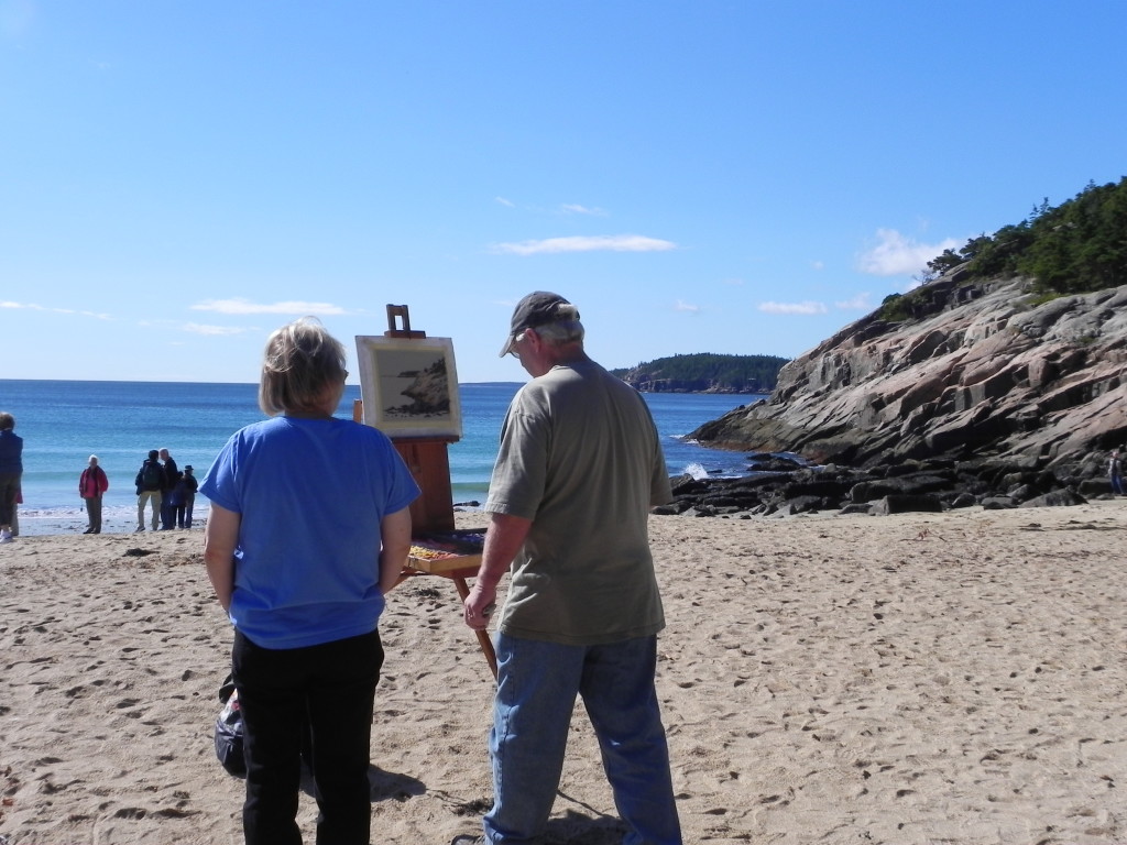 Artisti all'opera sulla spiaggia di Sand Beach