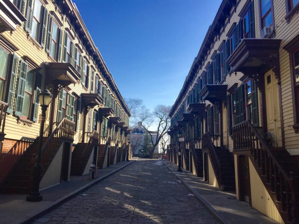 The Sylvan Terrace Historic District, on the background the Morris Jumel Mansion